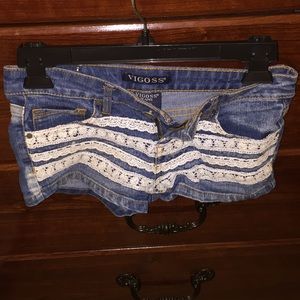 Pretty denim shorts with lace trimmings.